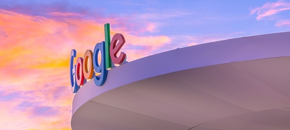 Google  logo on Booth , against backgrop of colourful cloud  in the sky