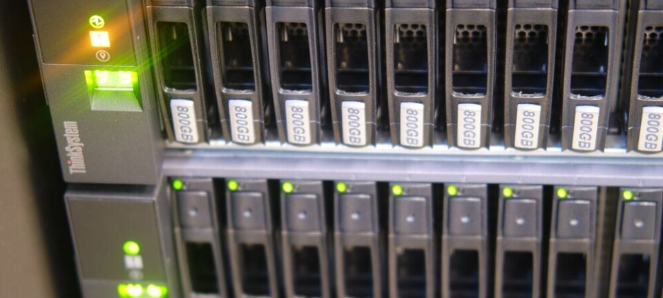 Close-up of Lenovo ThinkSystem server panel with hard disk bays and green status LEDs